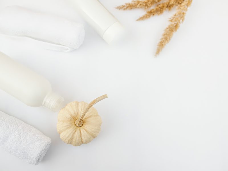 skincare products with pumpkin and autumnal decors.